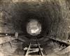 (INDUSTRIAL DISASTER--HAWKS NEST TUNNEL CONSTRUCTION) A pair of albums with 100 photographs documenting construction of the infamous tu